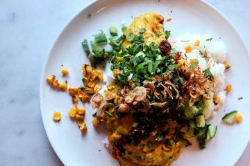 Jackfruit Rendang with sticky rice, brown butter fried corn and tangy greens