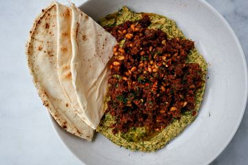 Herby hummus with harissa spiced lamb and pine nuts