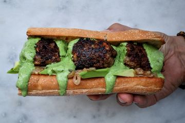 Lamb, date and ricotta meatball subs with avo, jammy shallots and herby sawse