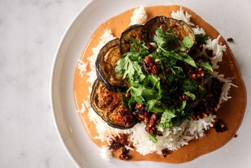 Coconut rice with spicy peanut sauce, crispy eggplant and scallion cilantro slaw